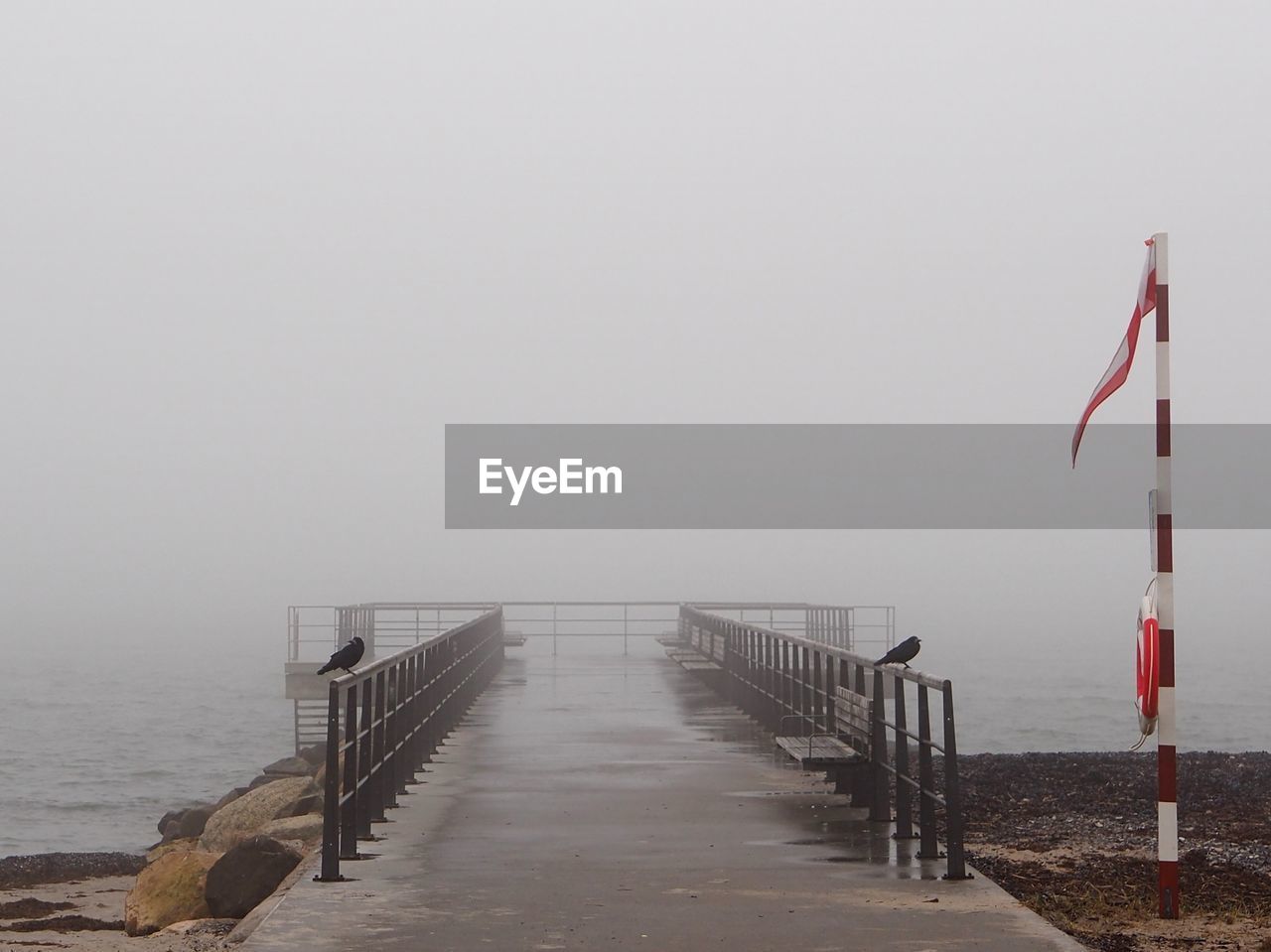 PIER BY SEA AGAINST SKY