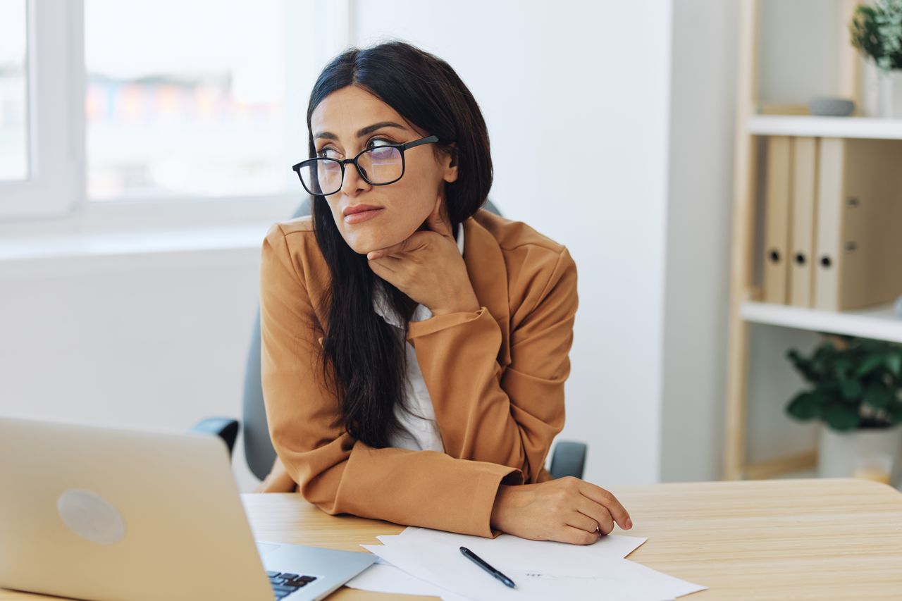 young businesswoman working at desk in office