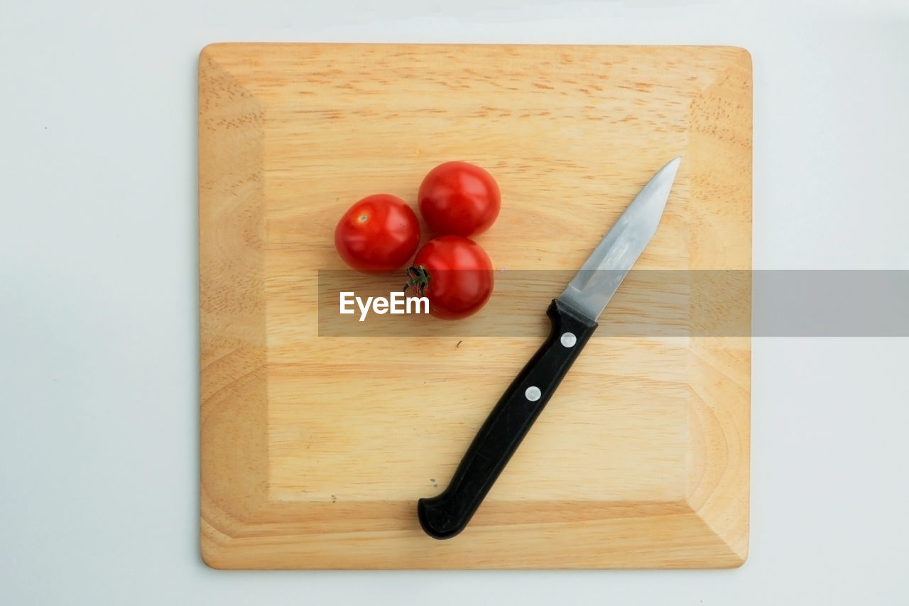 High angle view of tomatoes on cutting board