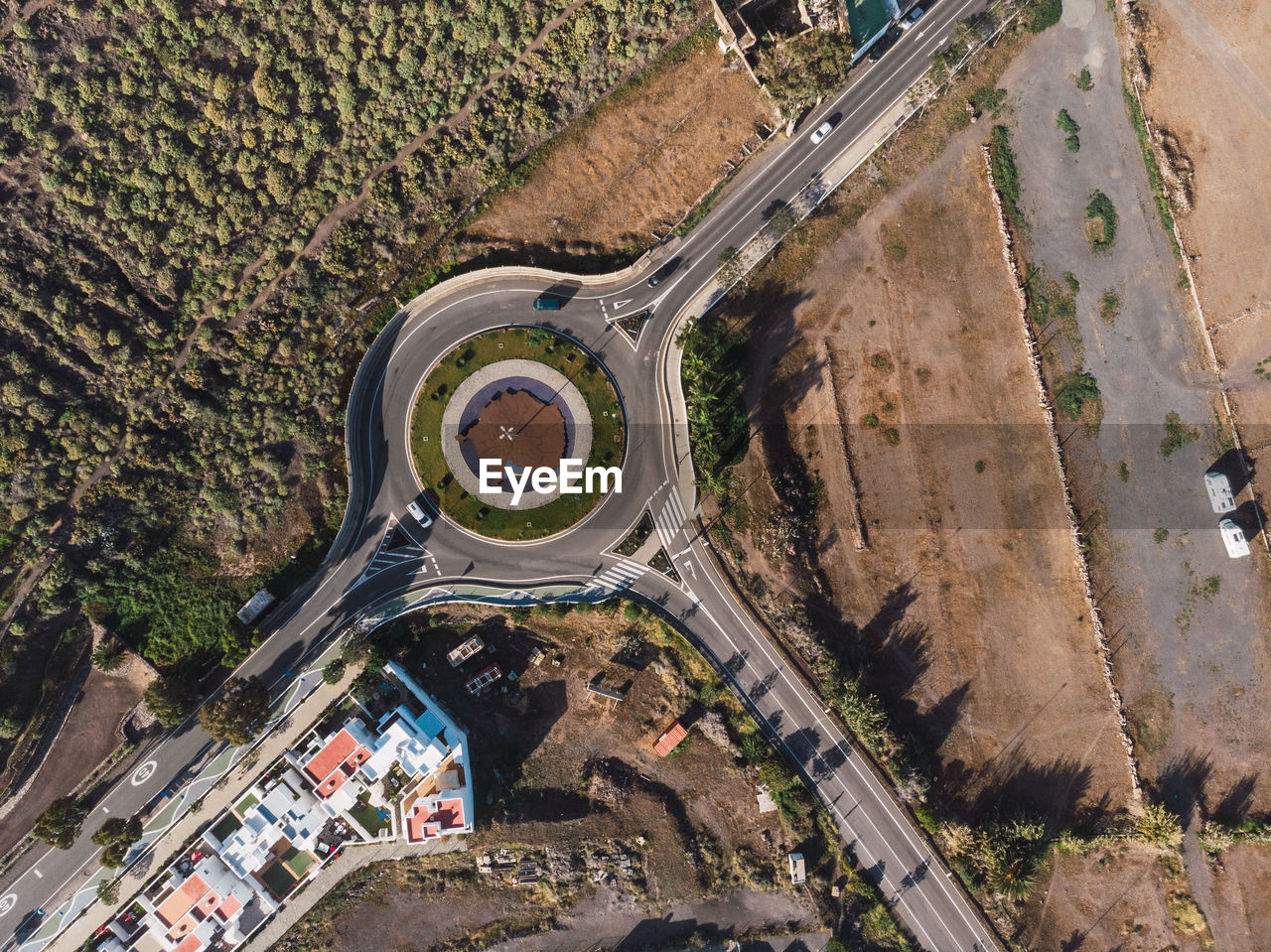Aerial top view of roadway with circle in countryside of gran canaria island, spain