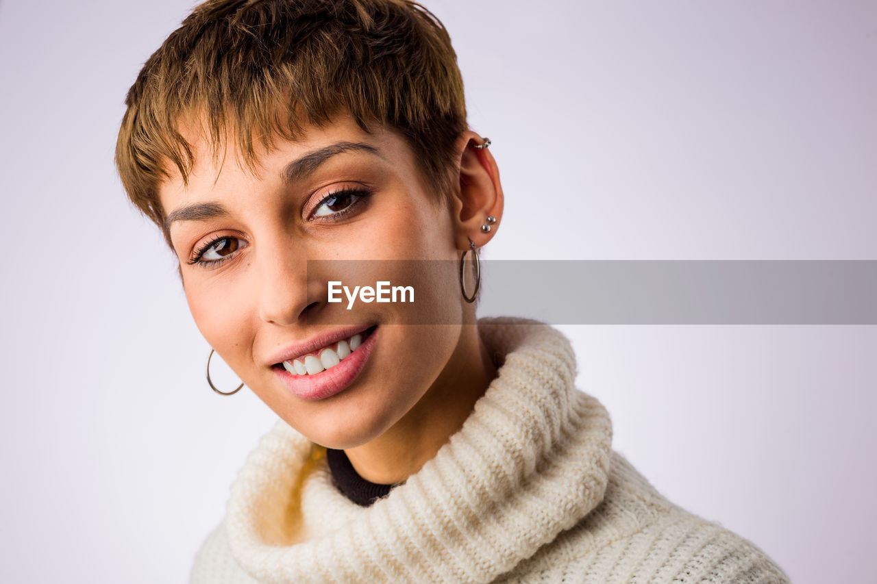 close-up of young woman against white background