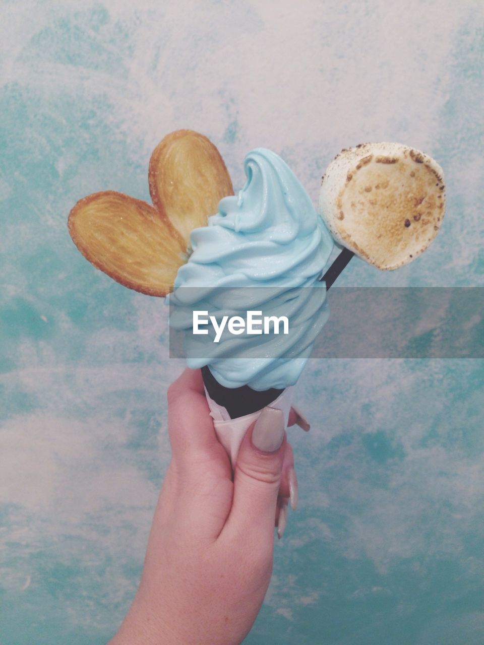 Cropped hand of woman holding ice cream cone