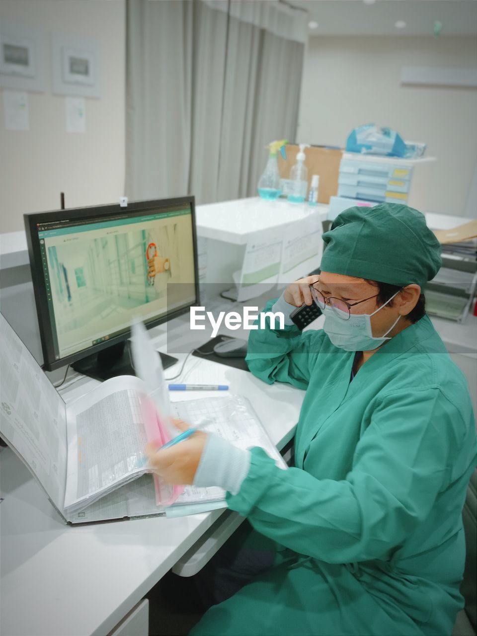 Rear view of man working in office