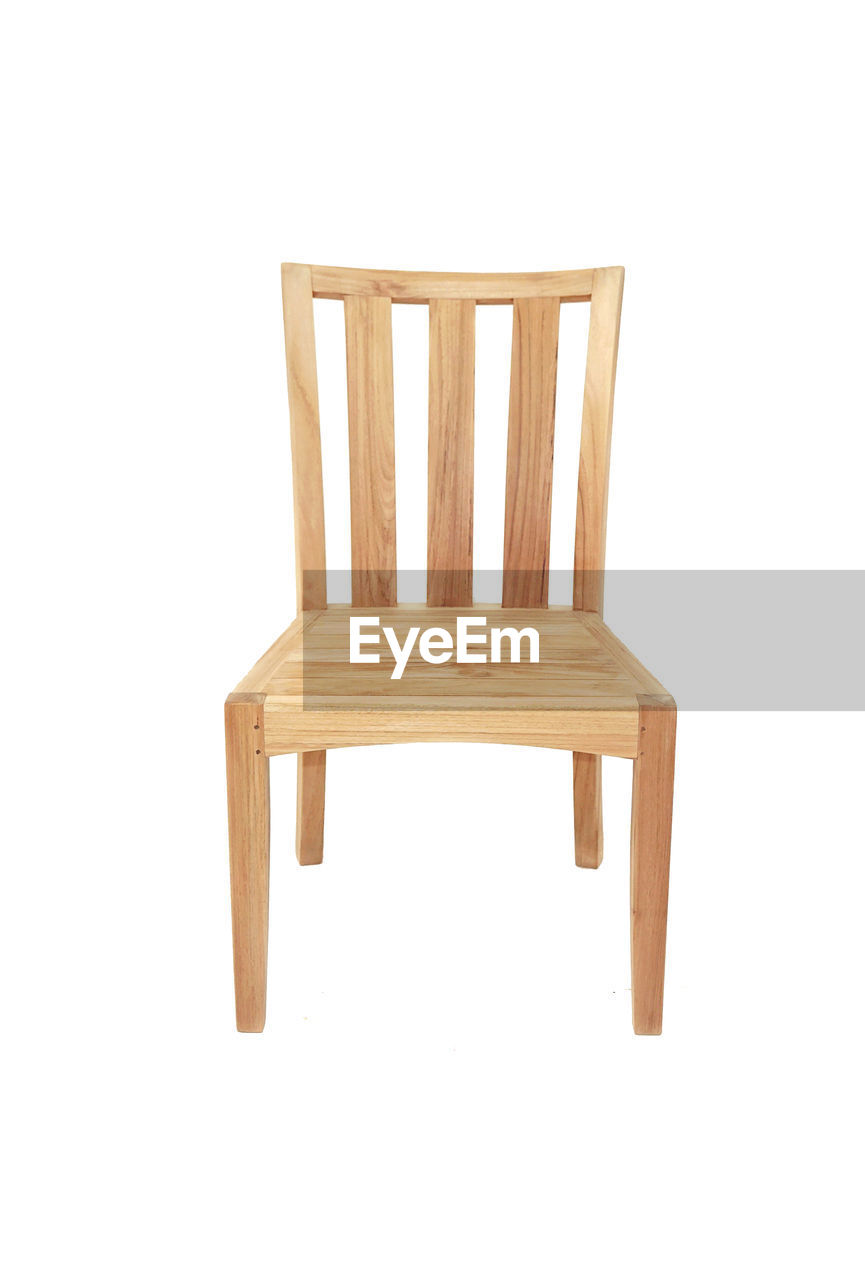 CLOSE-UP OF EMPTY CHAIR AGAINST WHITE BACKGROUND