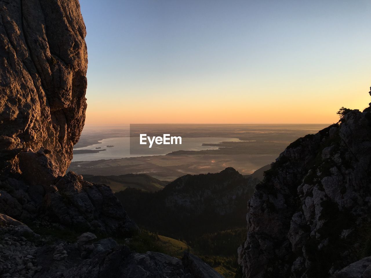 Scenic view of mountains against clear sky during sunset