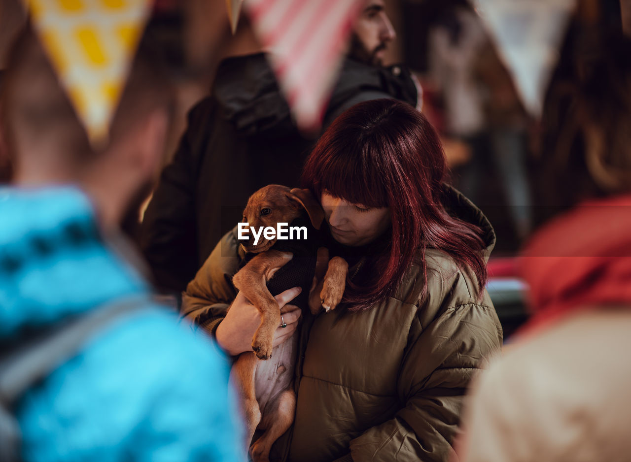 Woman holding dog 