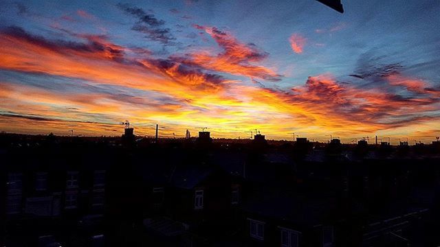 SILHOUETTE OF CITY AT SUNSET