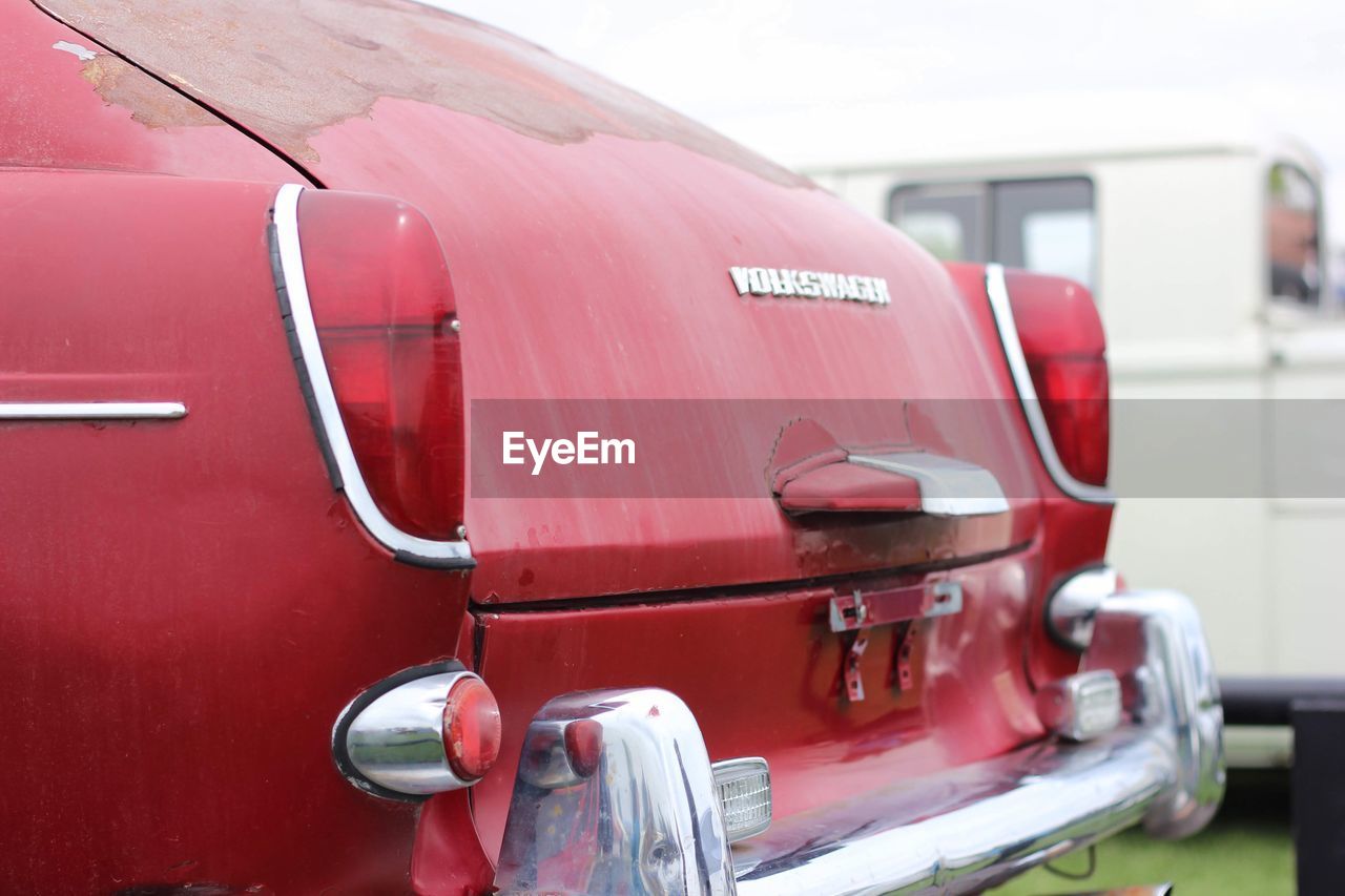 CLOSE-UP OF A RED VINTAGE CAR