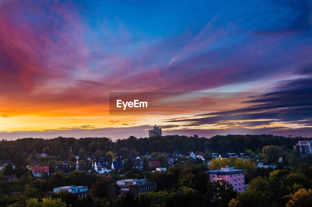 View of cityscape against sky at sunset