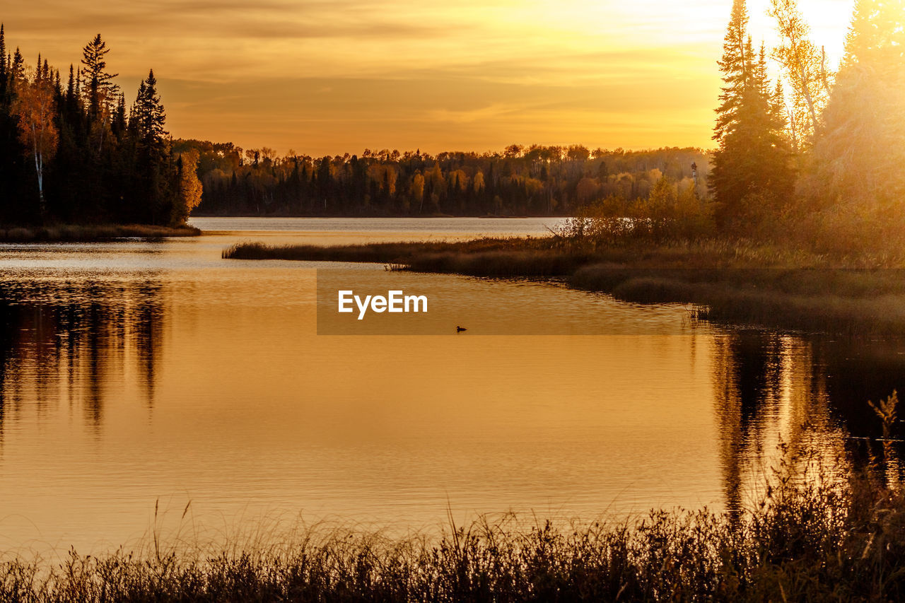 Scenic view of lake during sunset