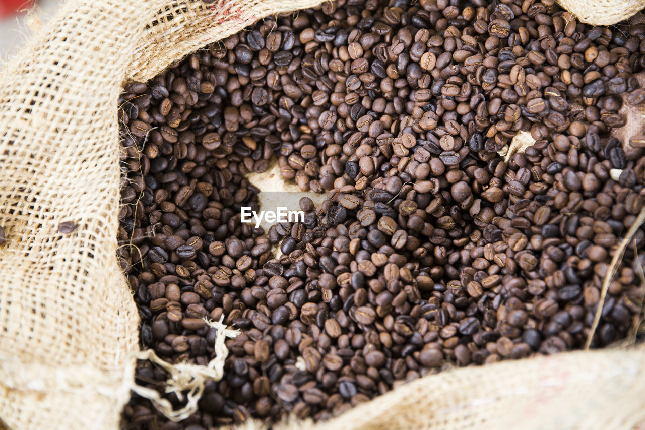 Full frame shot of roasted coffee beans in burlap