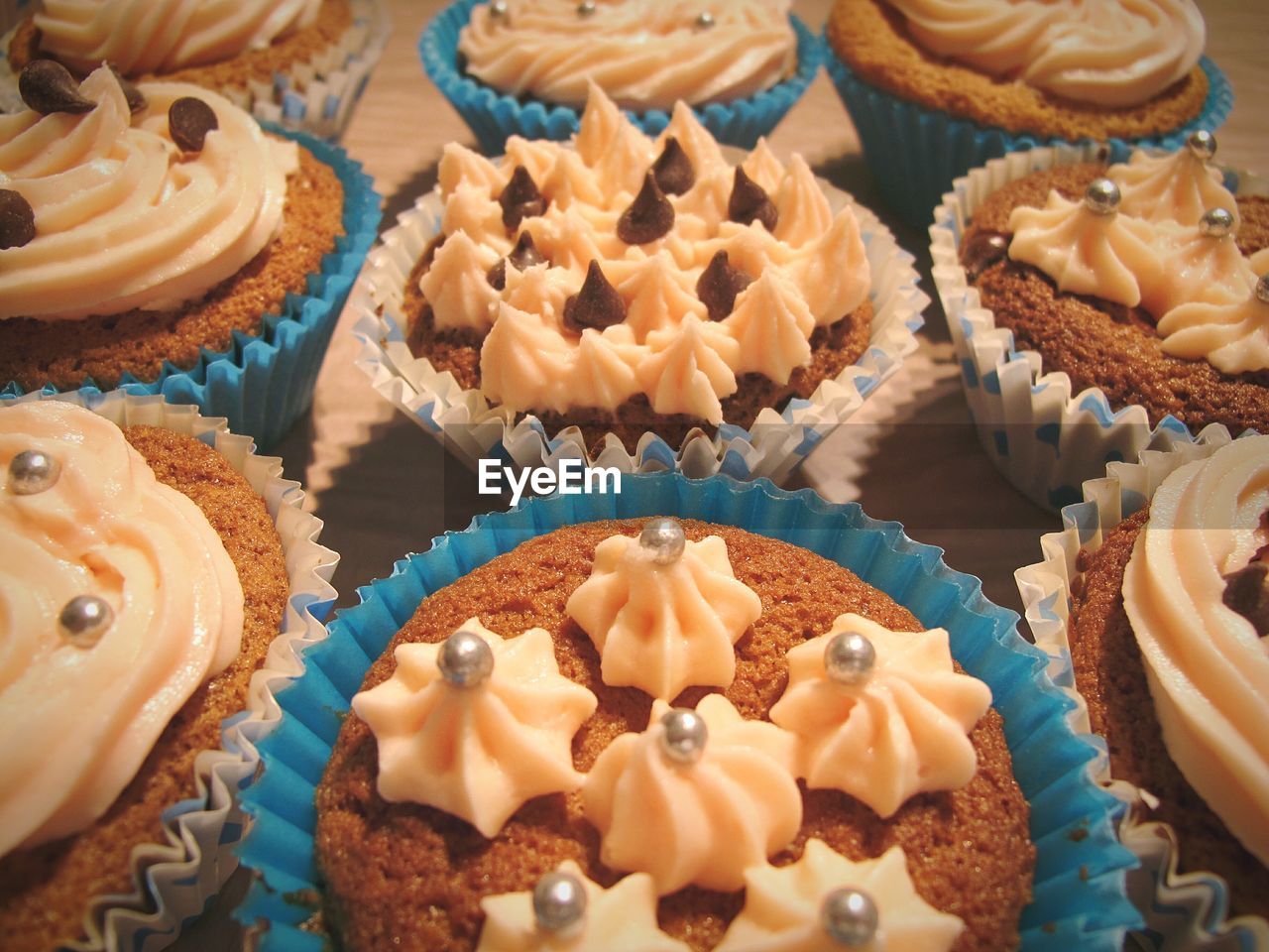 High angle view of various cupcake on table