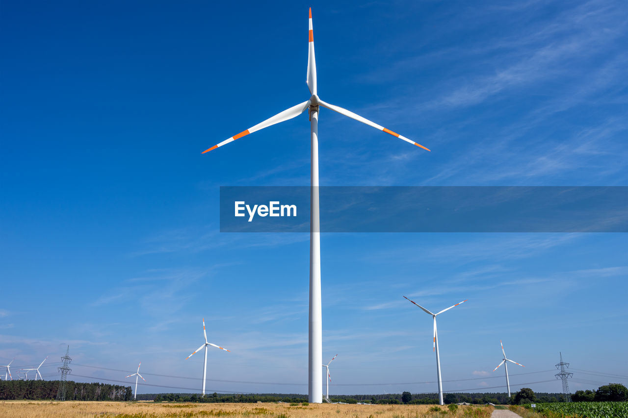 Modern wind turbines with power lines seen in germany