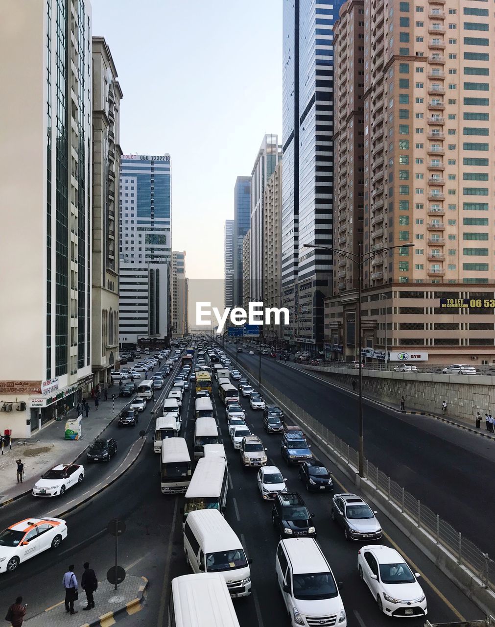 HIGH ANGLE VIEW OF CITY STREET AMIDST BUILDINGS