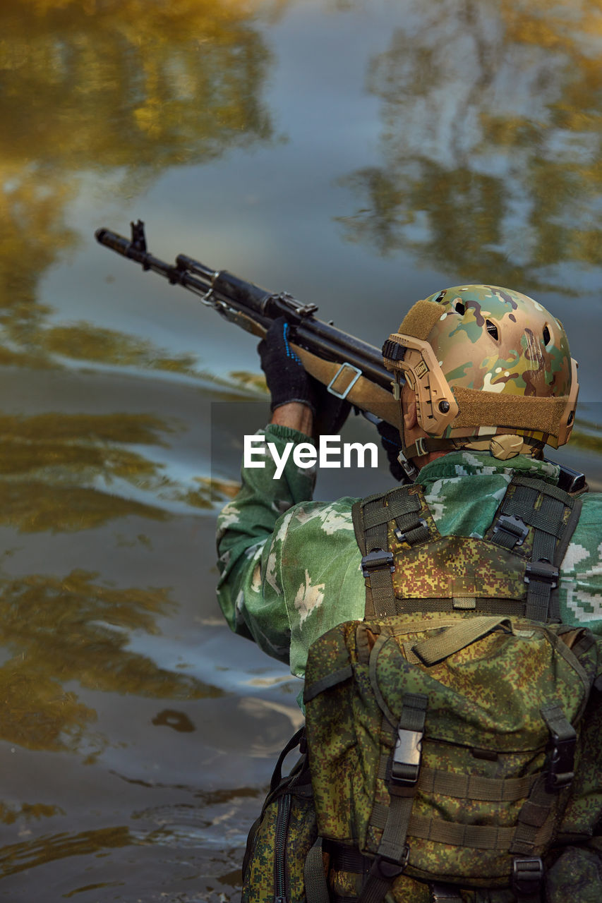 portrait of army soldiers with water in lake