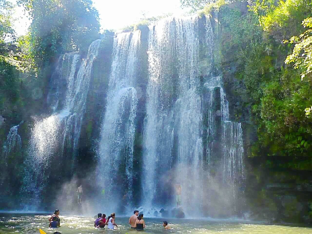 HIGH ANGLE VIEW OF WATERFALL IN FOREST