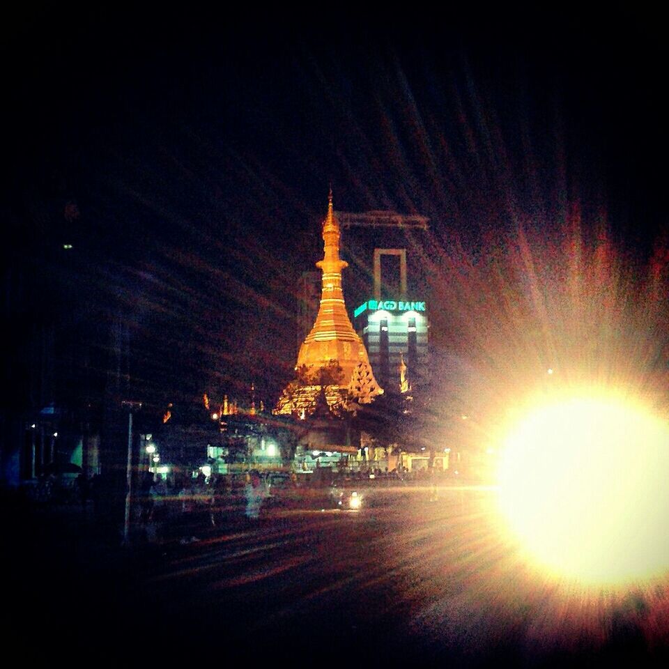 Sule pagoda by car light at night