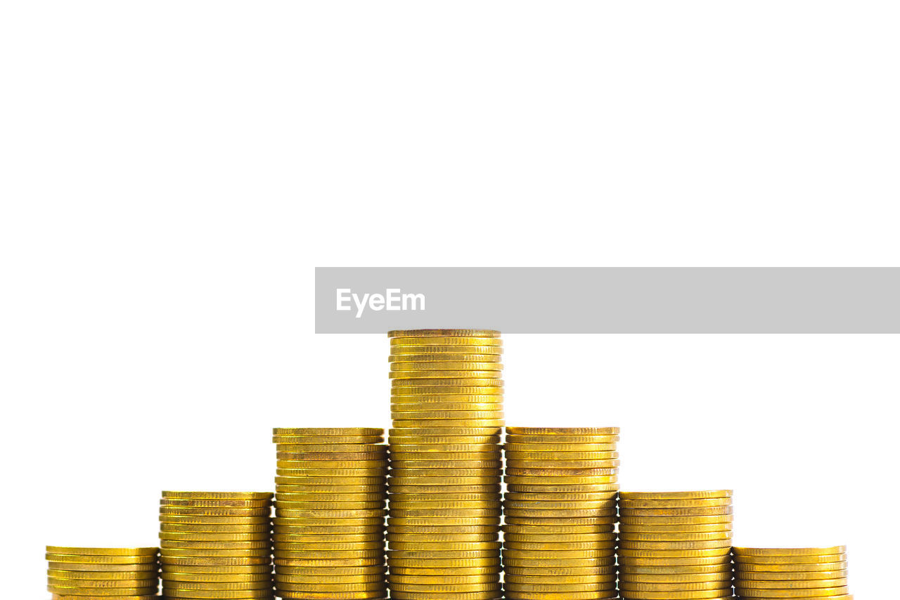 Columns of coins, piles of coins on white background, business and financial concept