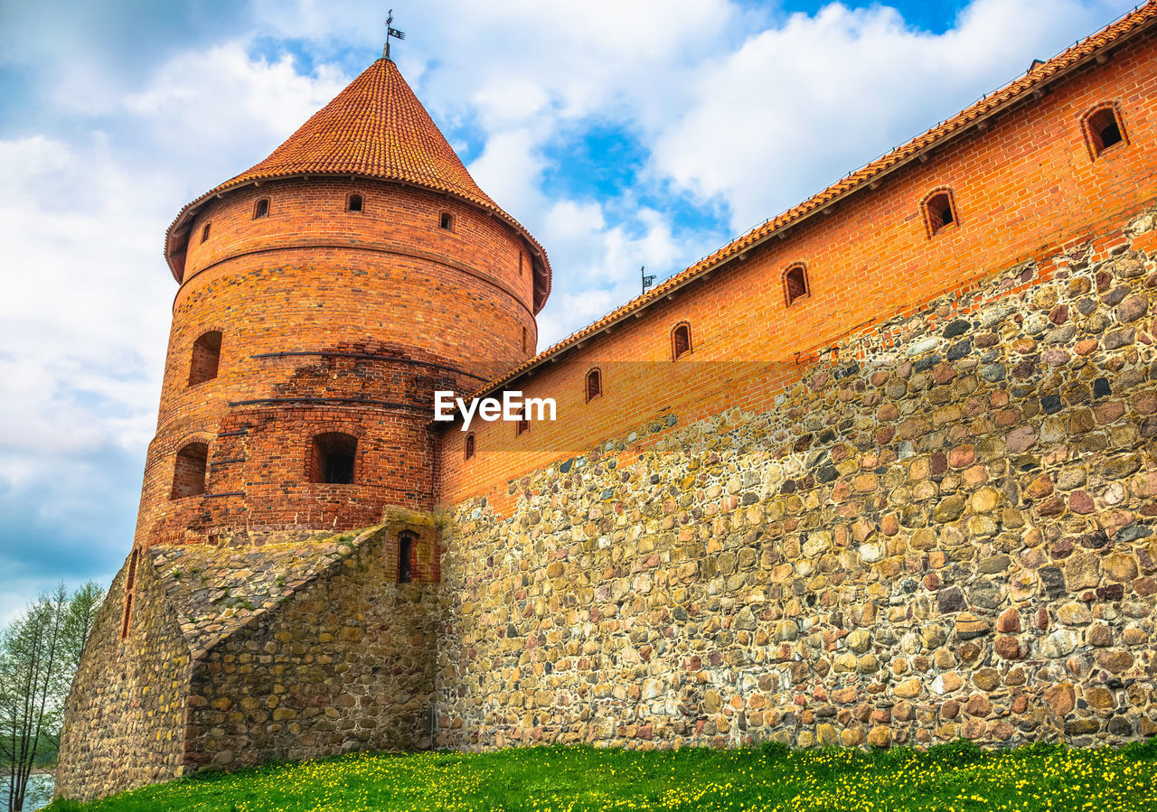 Fortified wall at trakai island castle against sky