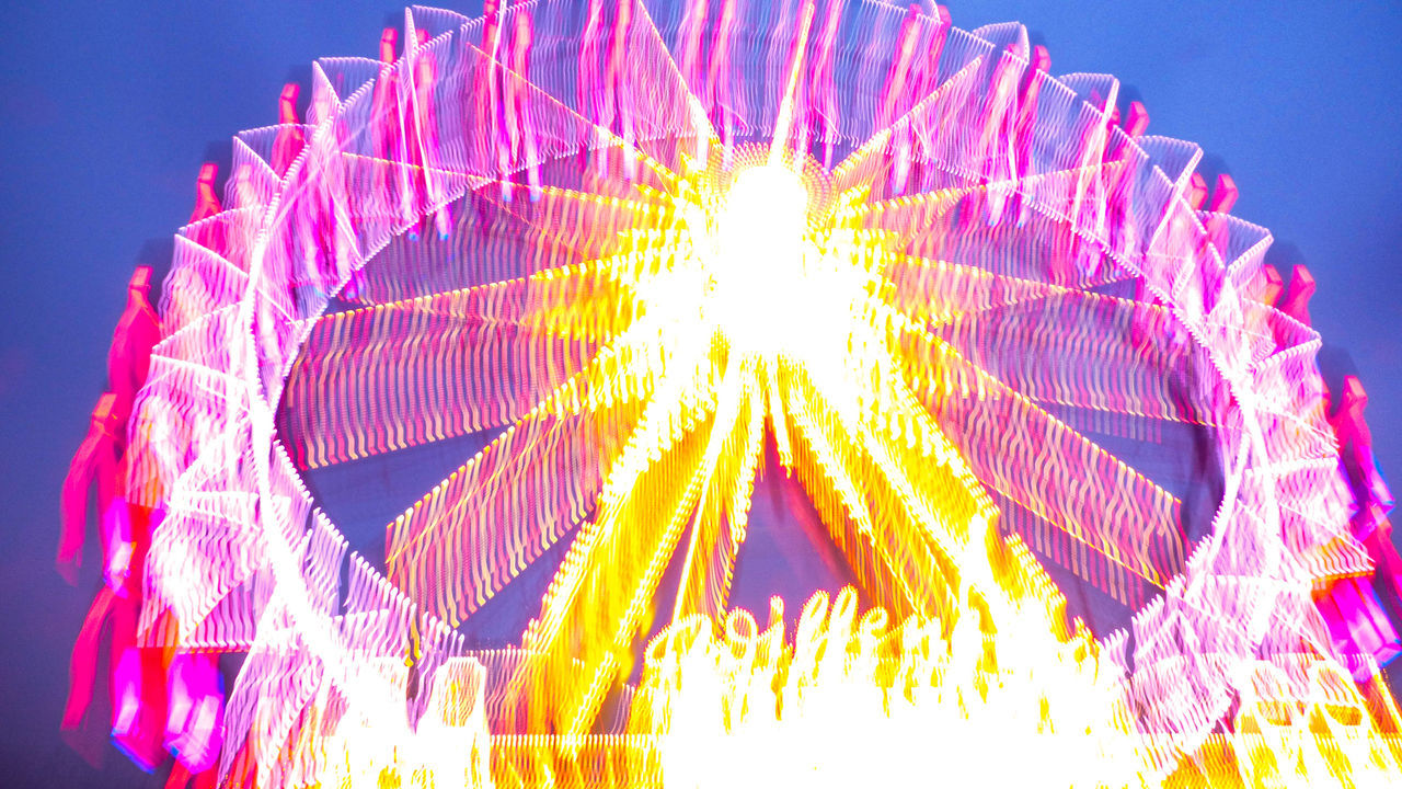 illuminated, arts culture and entertainment, amusement park, amusement park ride, night, low angle view, sky, multi colored, ferris wheel, motion, no people, celebration, recreation, blue, nature, glowing, outdoors, traveling carnival, event, carnival