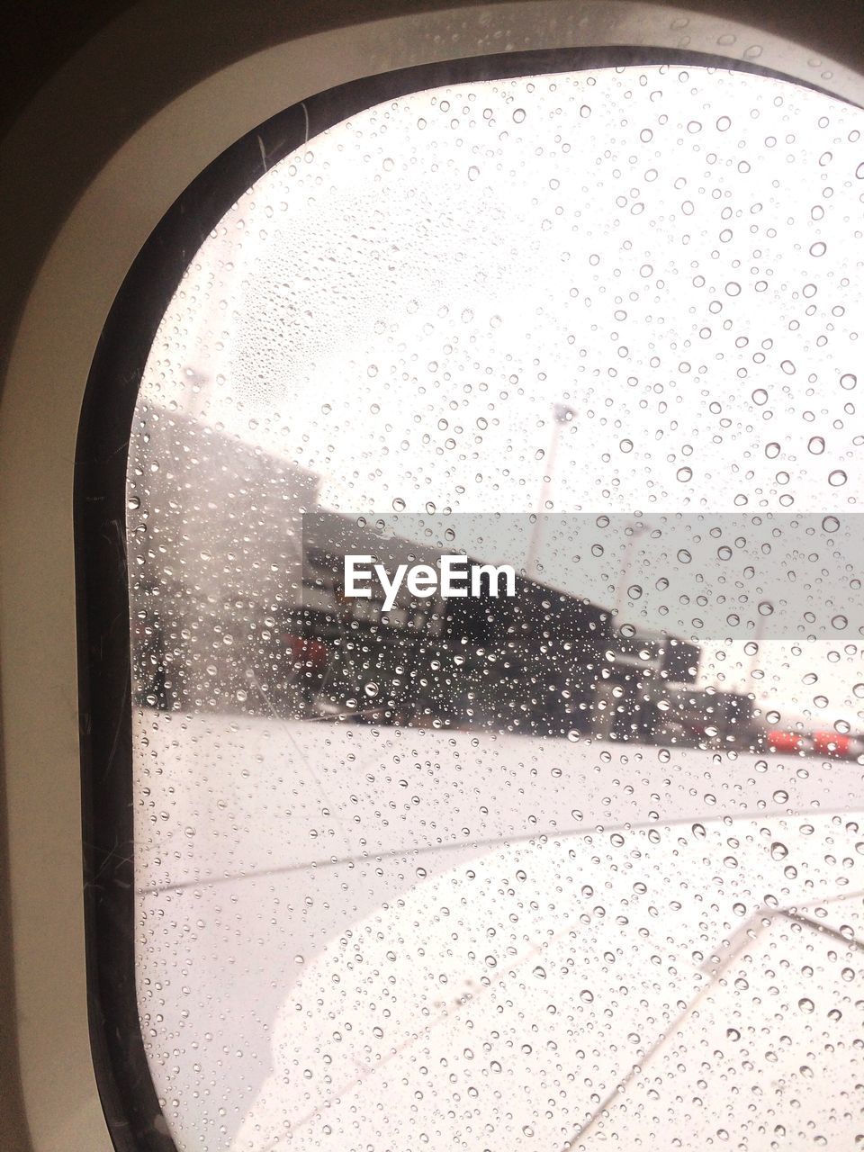 Close-up of wet airplane window