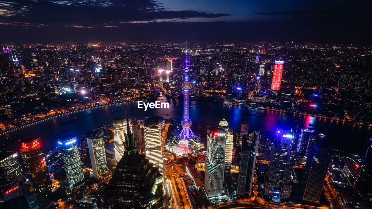 High angle view of illuminated city at night