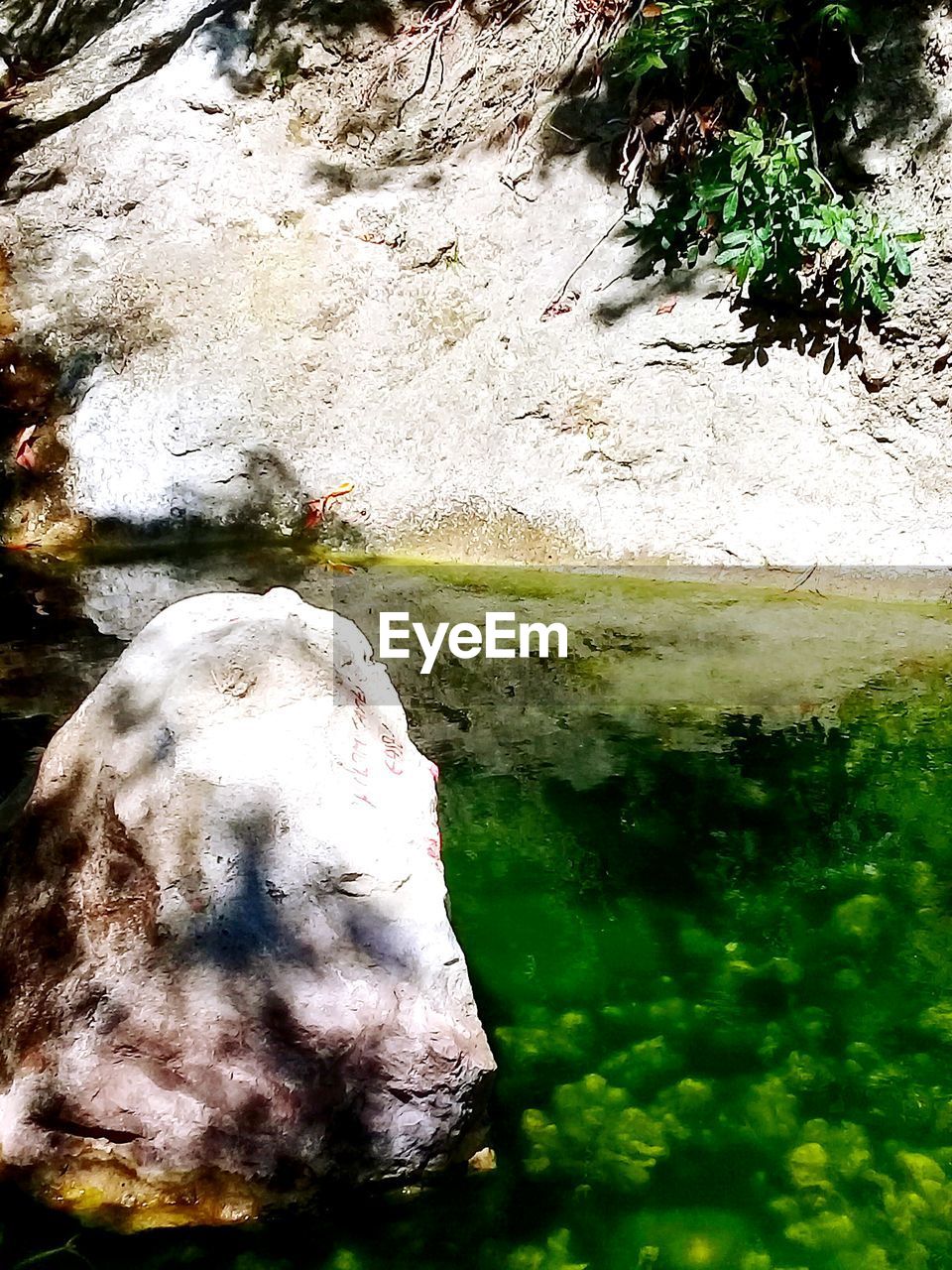 WATER FLOWING THROUGH ROCKS ON ROCK