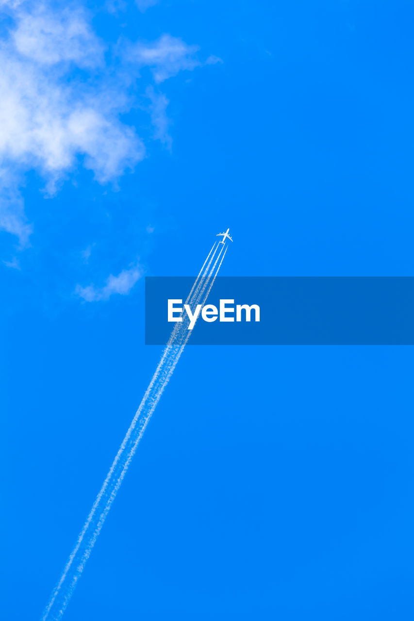 sky, cloud, blue, vapor trail, air vehicle, transportation, airplane, mode of transportation, flying, nature, travel, no people, on the move, low angle view, line, copy space, motion, day, speed, outdoors, wing, journey, smoke, aircraft, mid-air