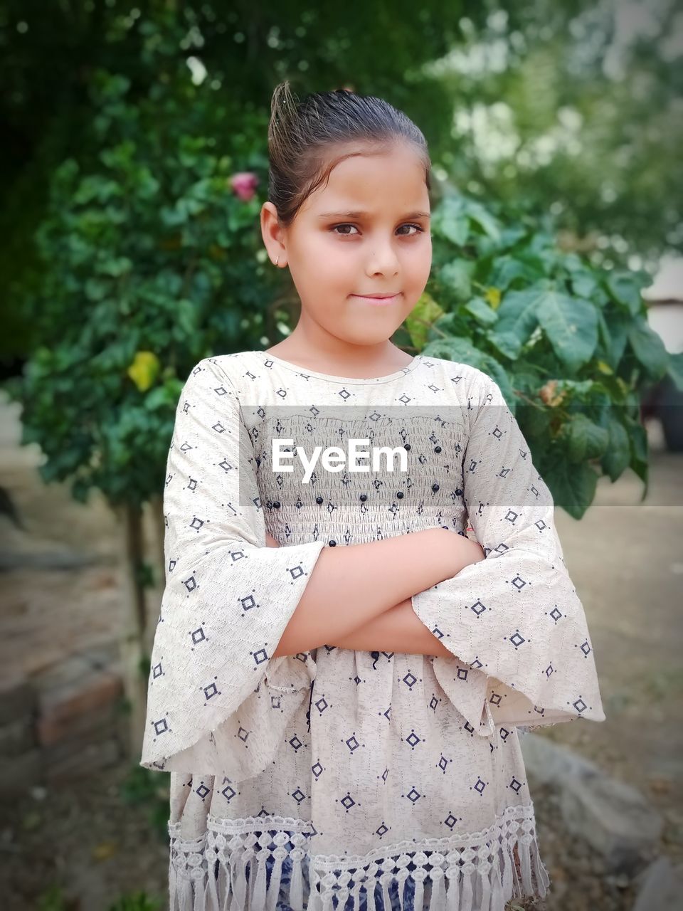 Portrait of smiling girl standing outdoors