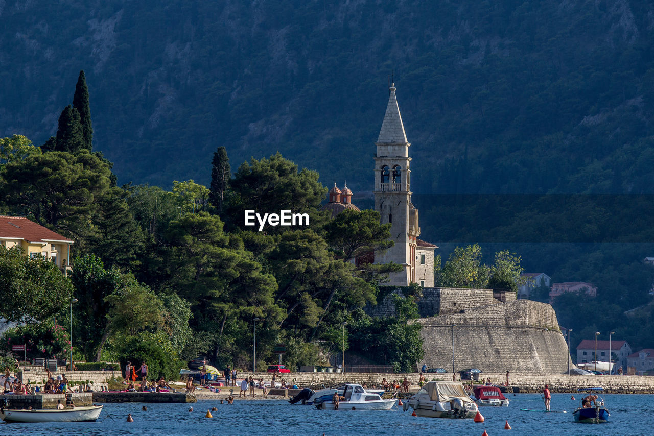 Cathedral by sea against mountain