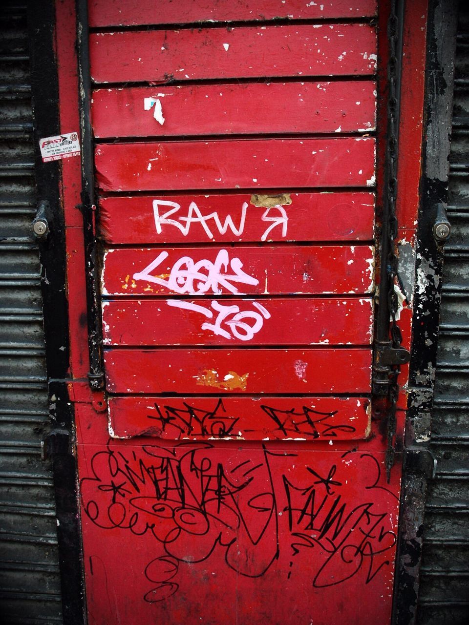 Close-up of text on red door