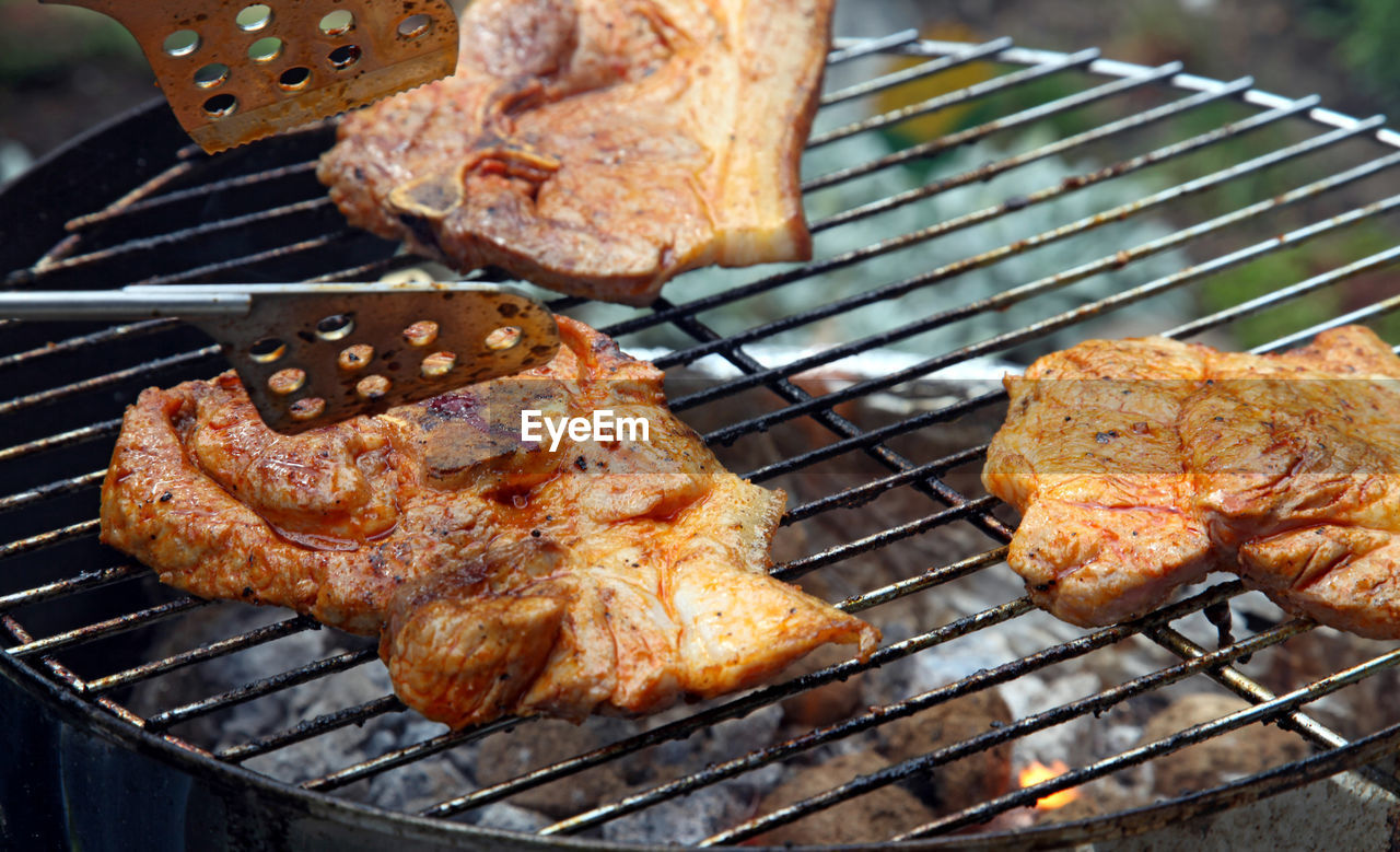 Close-up of meat cooking on barbecue grill