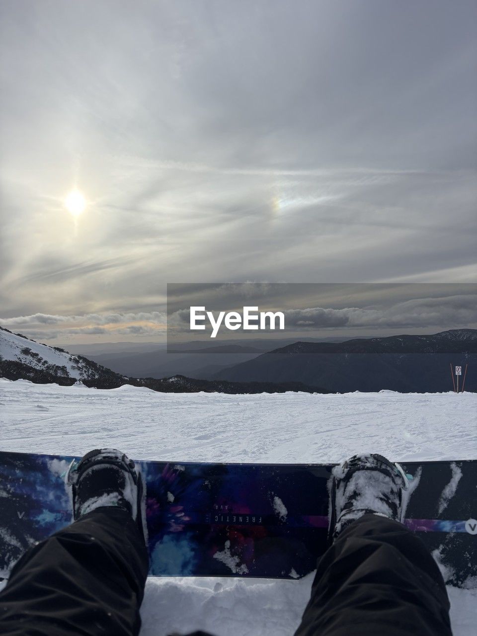 snow, blue, one person, nature, winter, sky, low section, day, human leg, cold temperature, sports, water, leisure activity, men, outdoors, ice, footwear, scenics - nature, shoe, lifestyles, clothing, beauty in nature, mountain, adult, sunlight, cloud, personal perspective, winter sports, motion