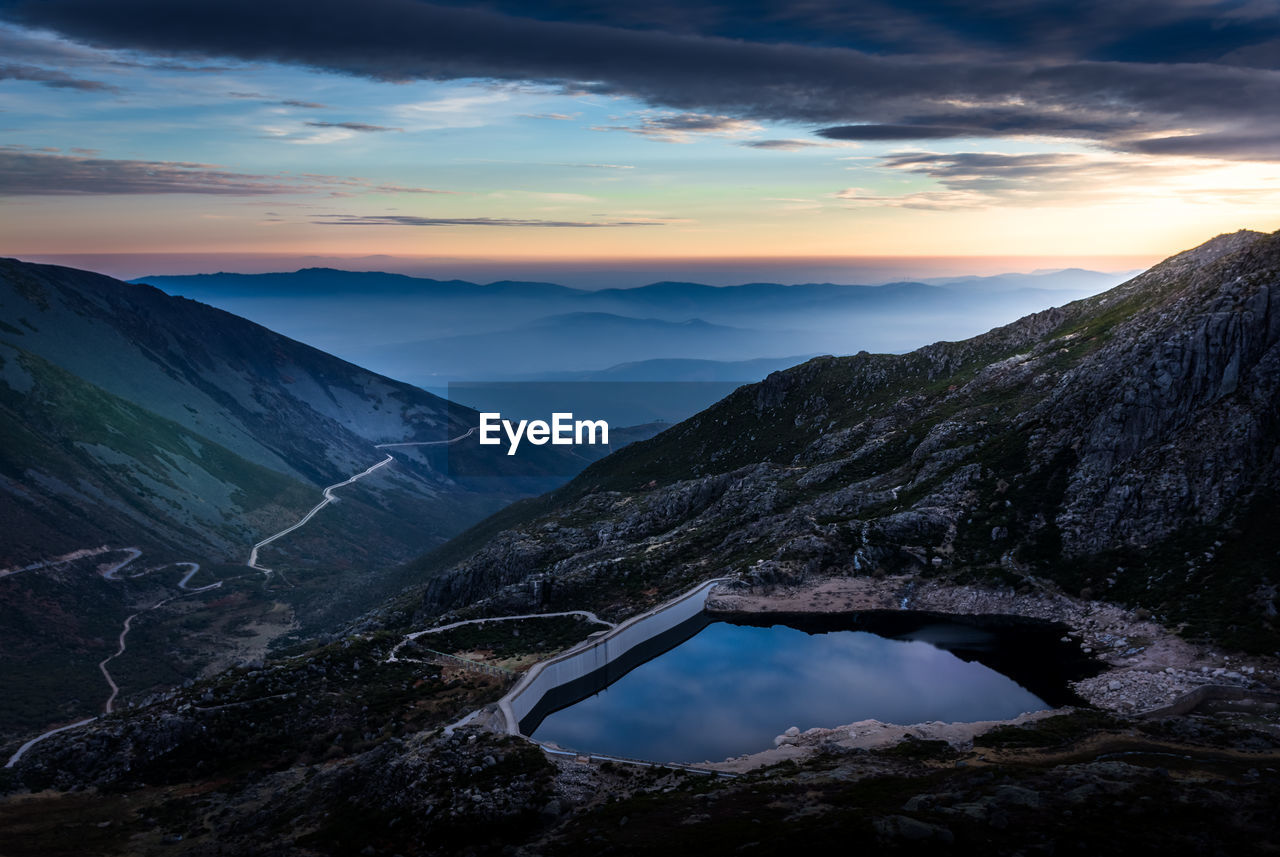 Scenic view of mountains against sky during sunset