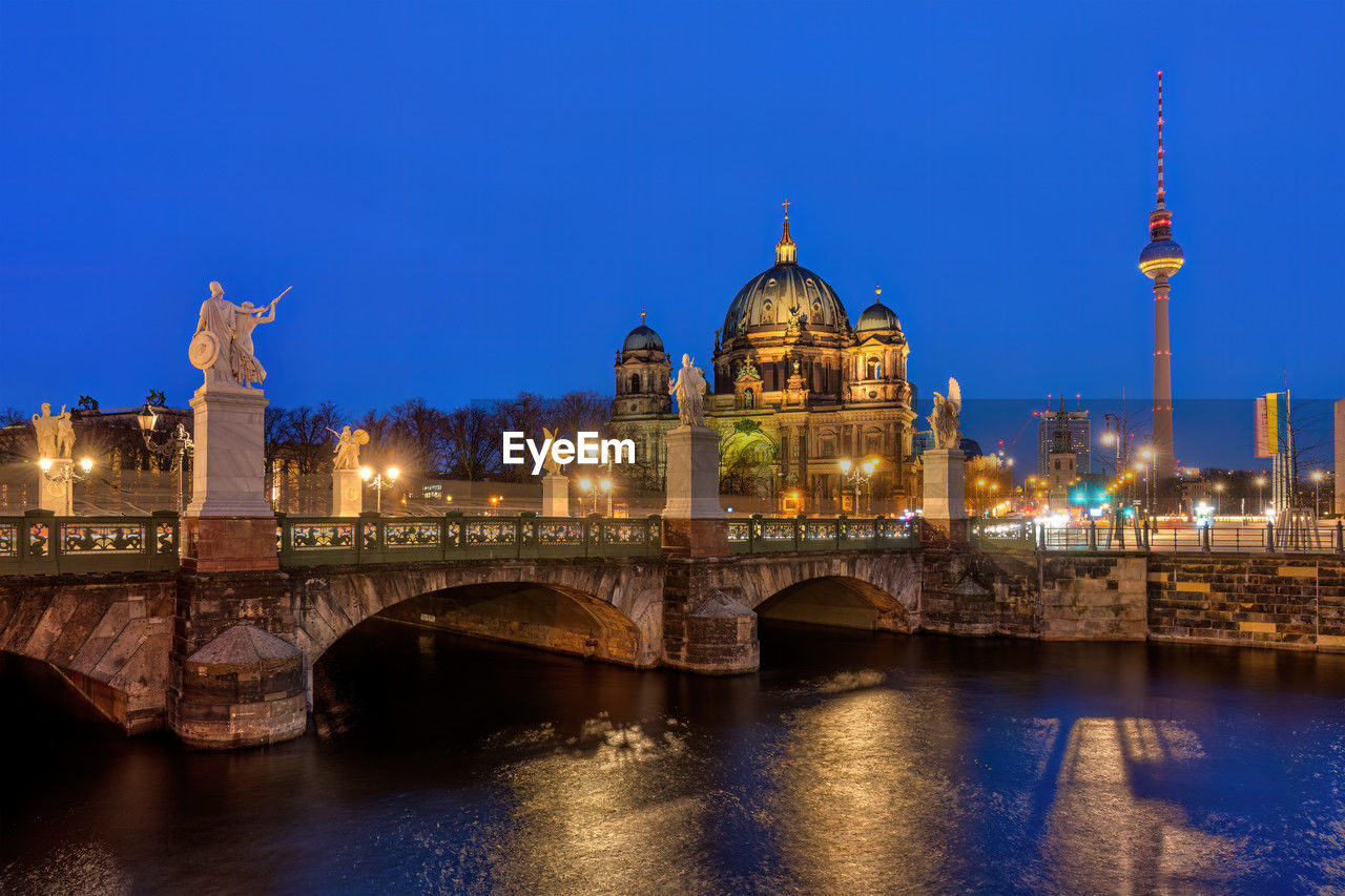 The berlin cathedral with the famous tv tower at night