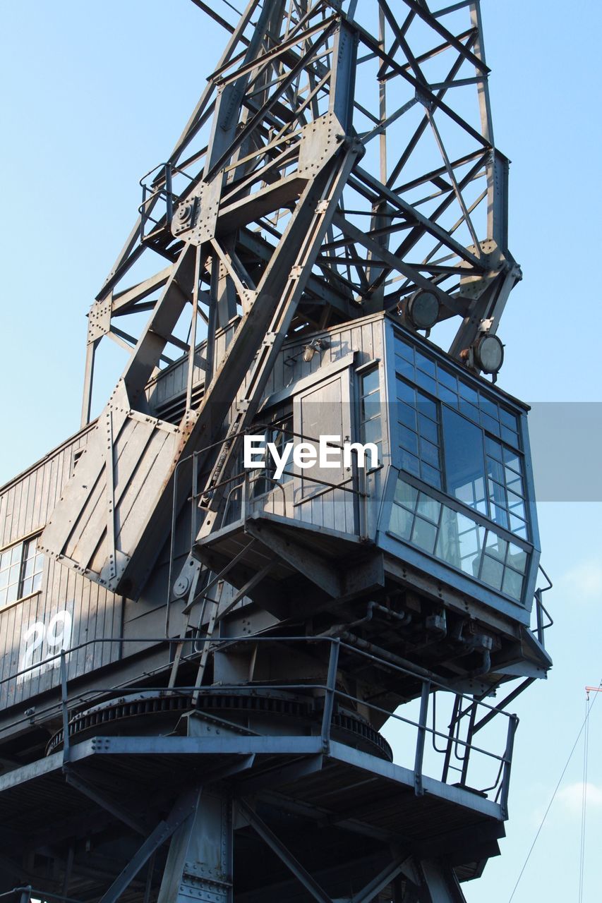 LOW ANGLE VIEW OF METAL STRUCTURE AGAINST SKY