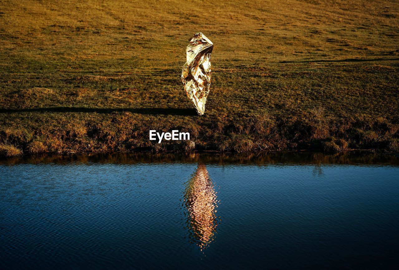 View of people by lake. reflection. 