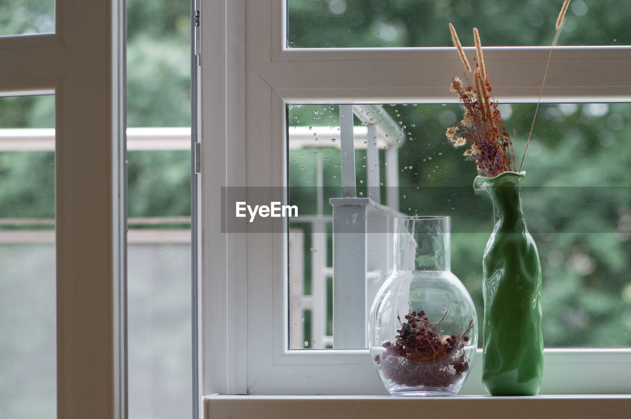 Close-up of vase on window sill