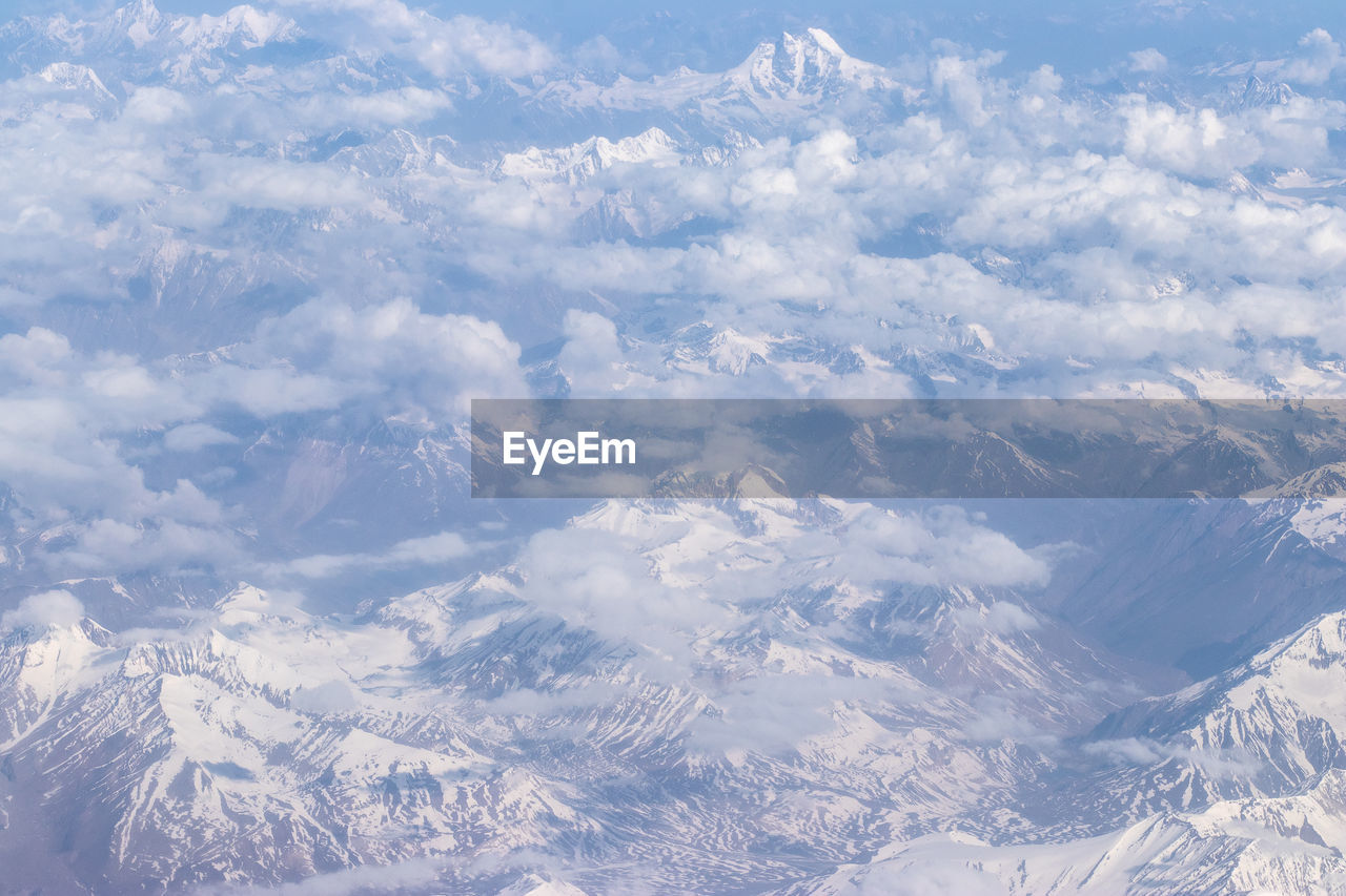 AERIAL VIEW OF SNOWCAPPED MOUNTAIN