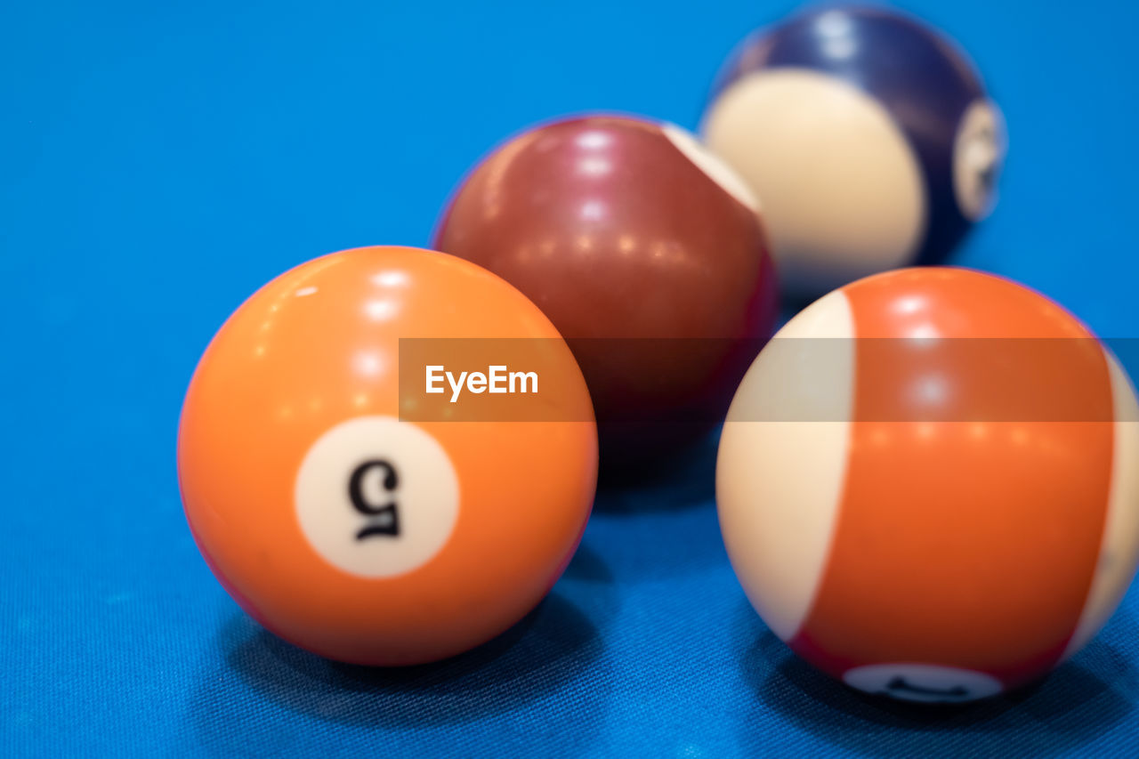 Close-up of colorful balls on pool table