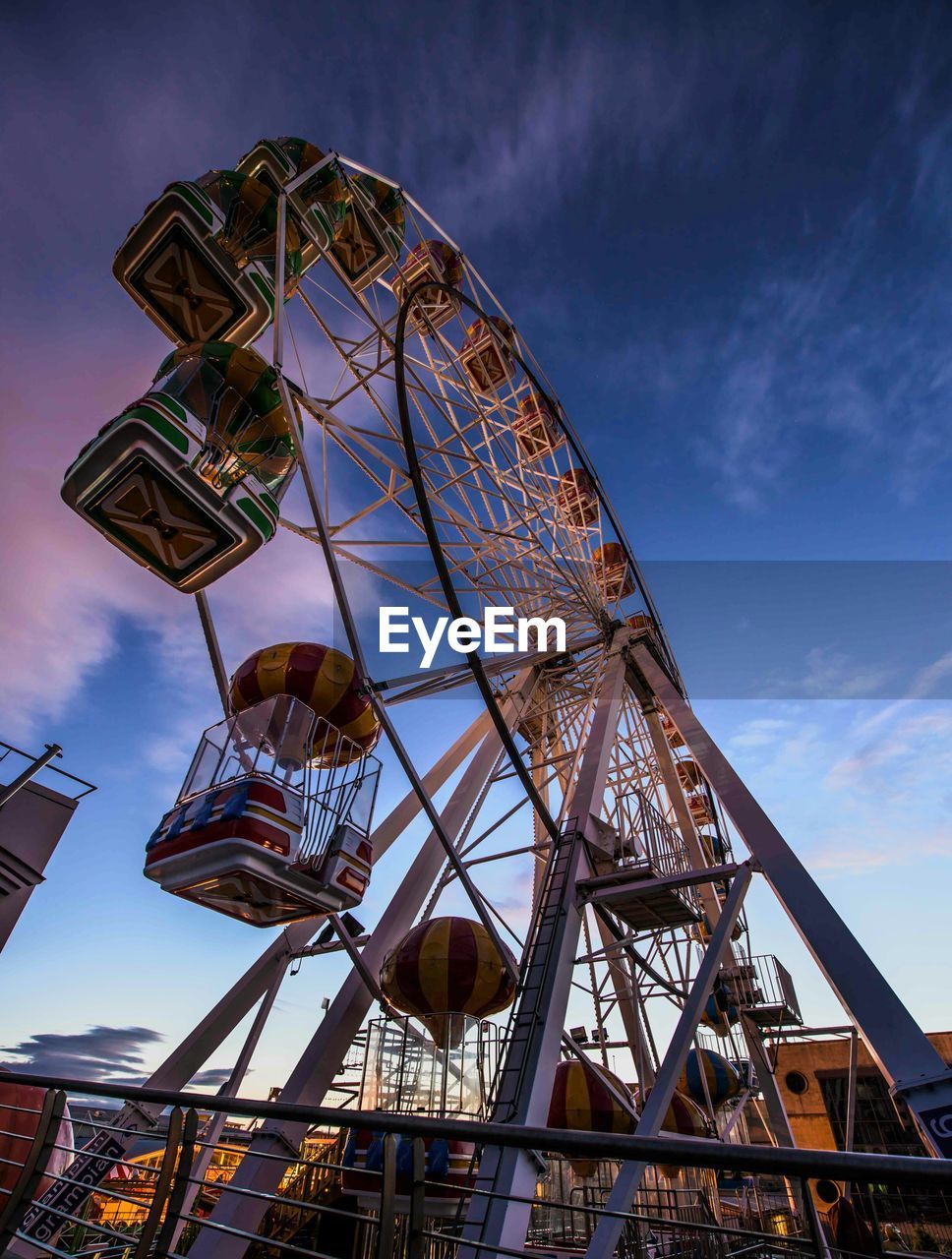 LOW ANGLE VIEW OF FERRIS WHEEL AGAINST SKY