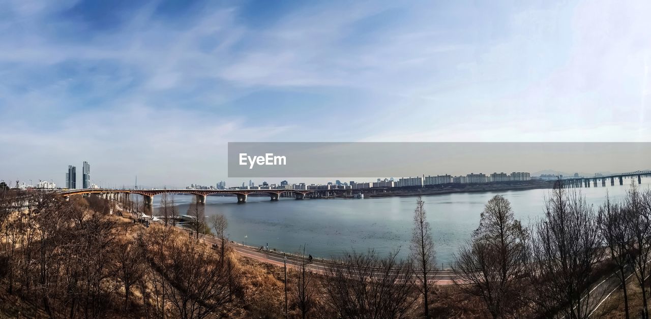 PANORAMIC VIEW OF BRIDGE OVER RIVER AGAINST SKY