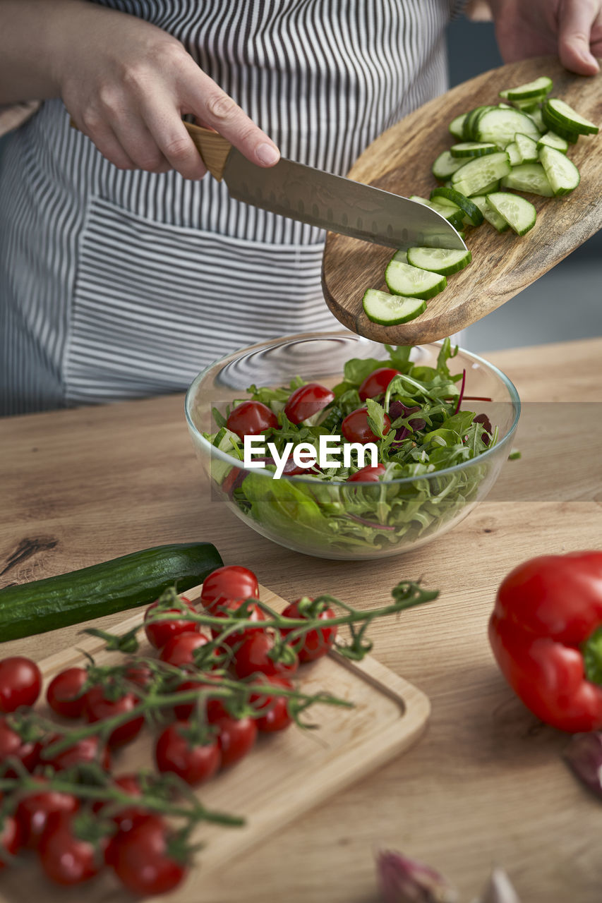 midsection of man preparing food