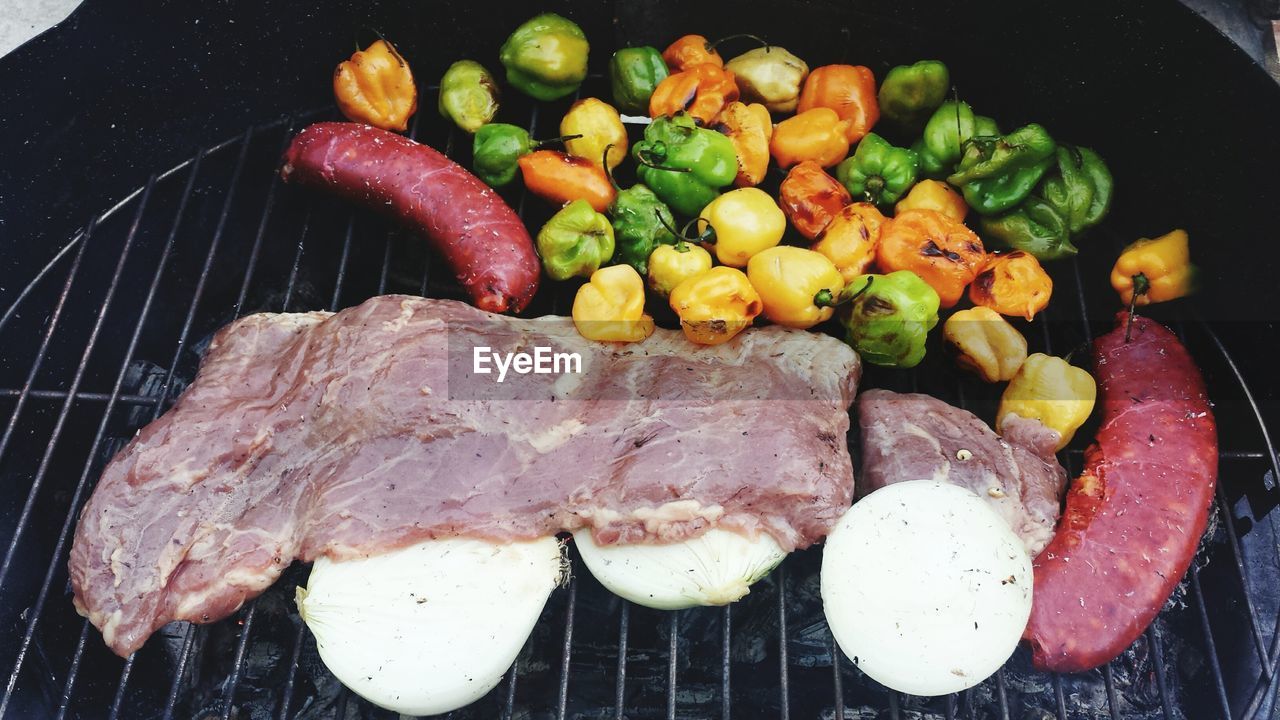 Close-up of meat and vegetables on barbecue grill