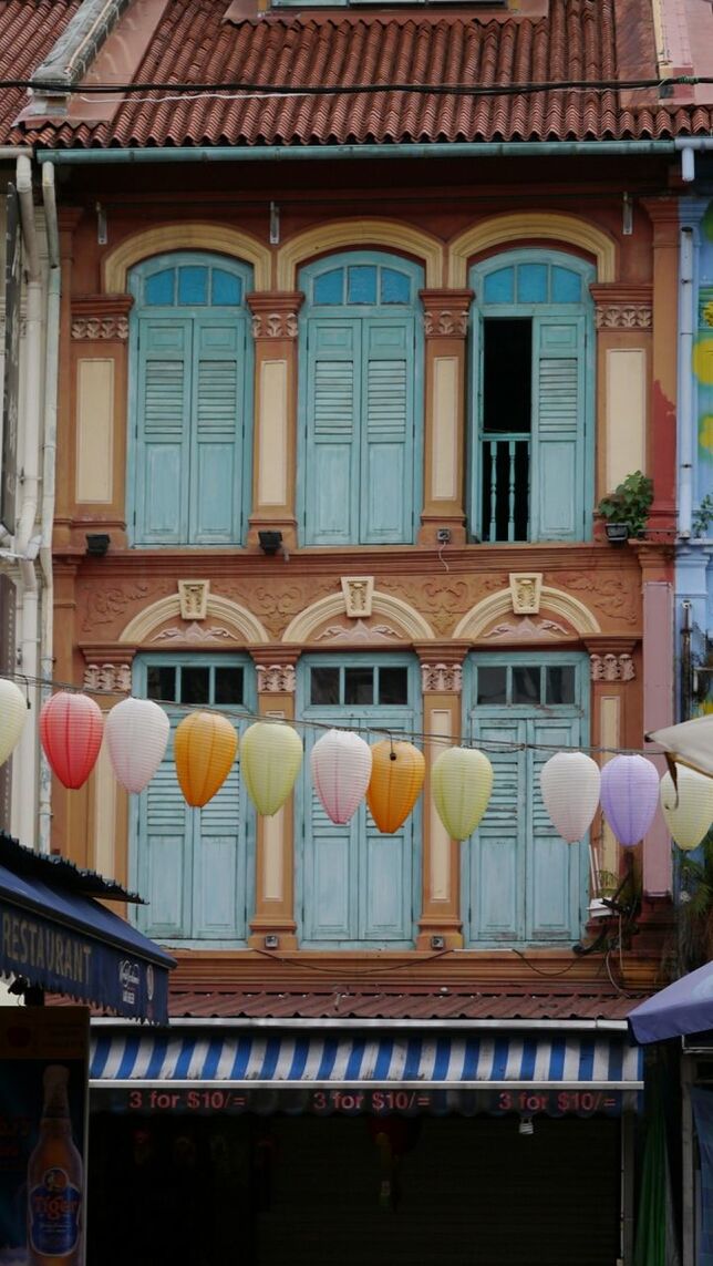 VIEW OF BUILDING WITH BALCONY