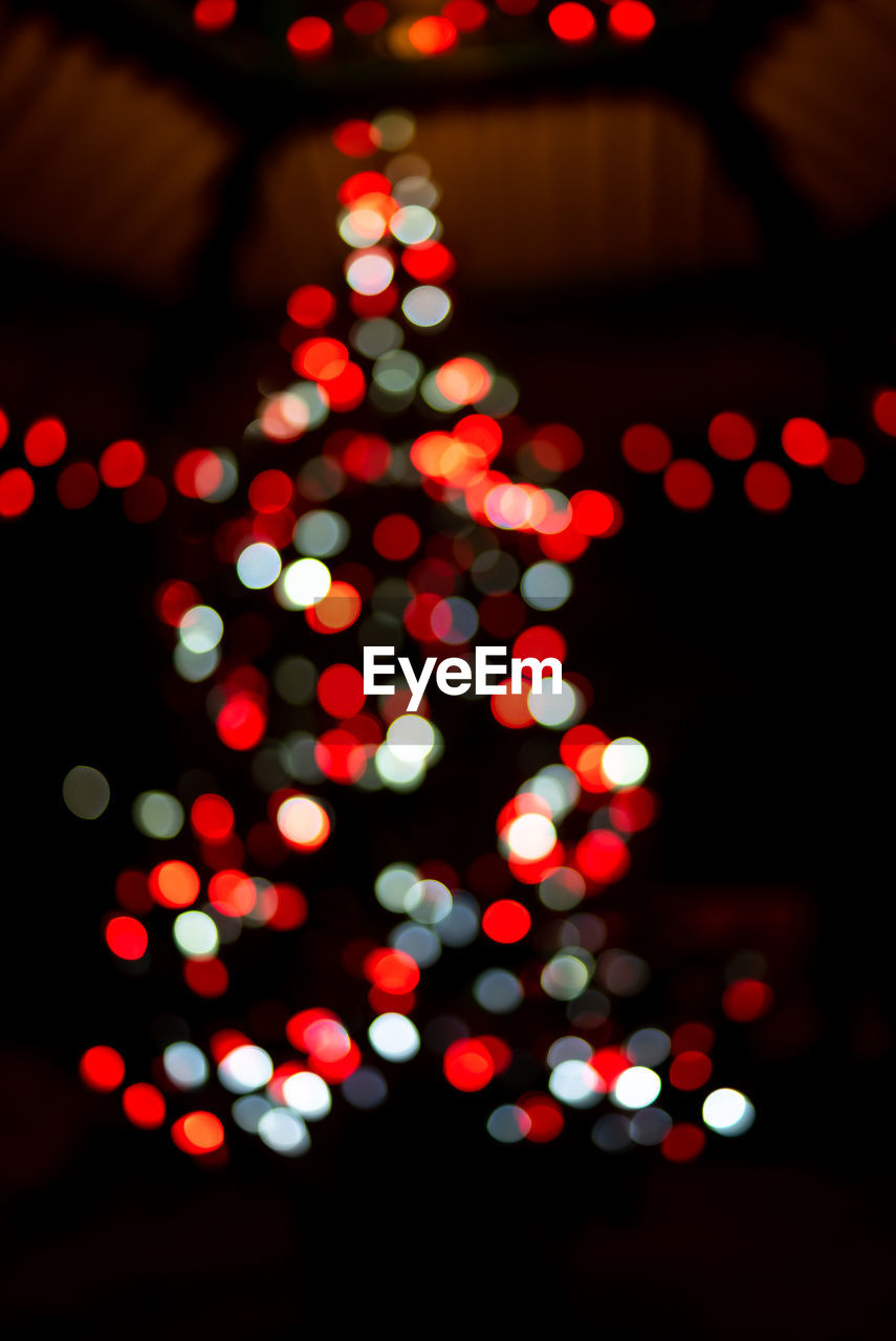 Defocused image of illuminated christmas tree