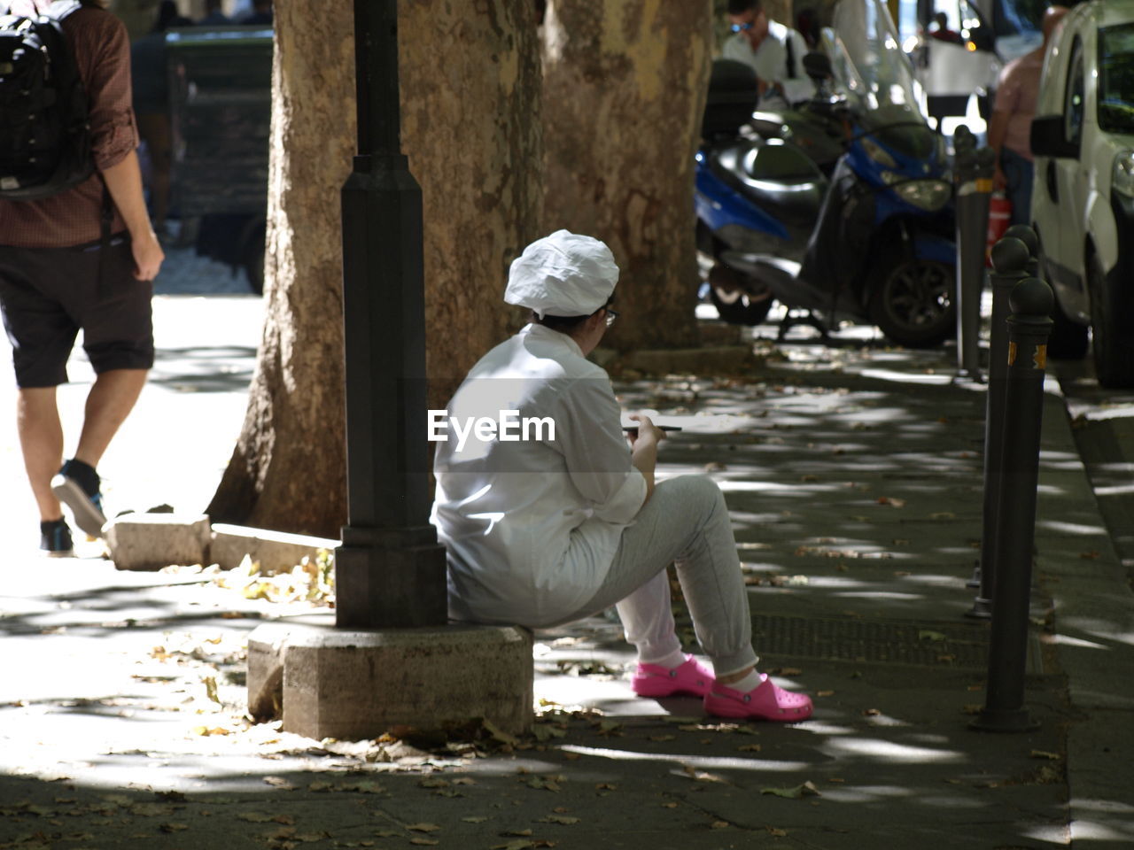 MAN SITTING IN PARK