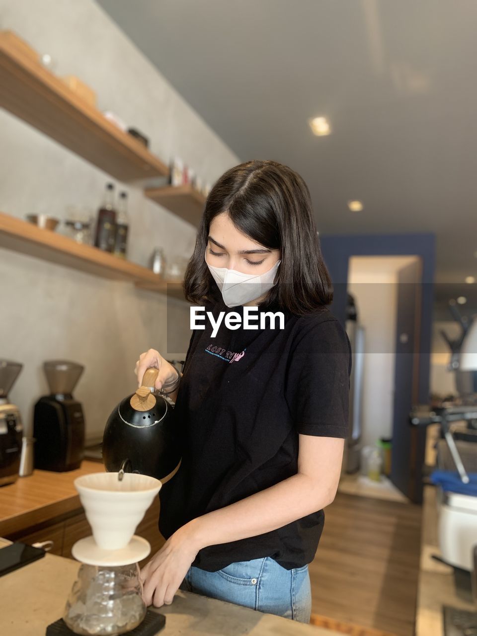 Full length of woman standing at restaurant