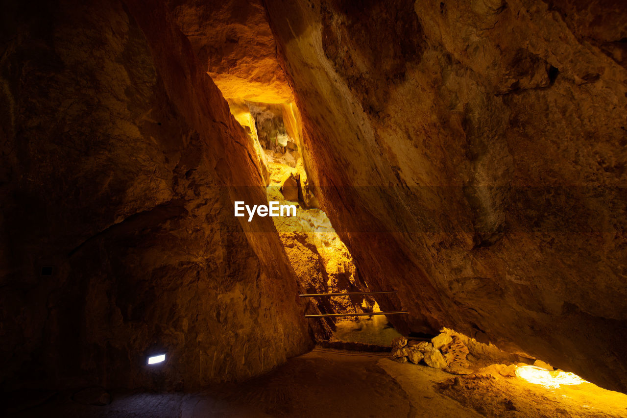 VIEW OF CAVE IN CANYON