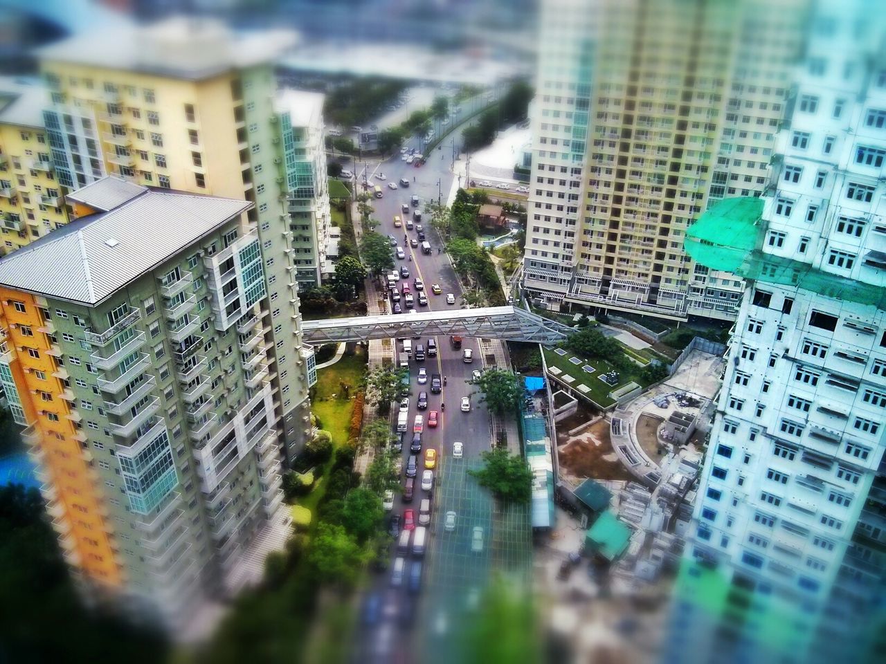 High angle view of vehicles on street along buildings